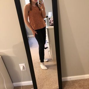 coral tank top with floral detailing